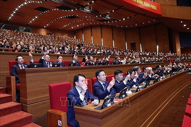Đại biểu biểu quyết tại Đại hội. Ảnh: TTXVN Đại biểu biểu quyết tại Đại hội. Ảnh: TTXVN