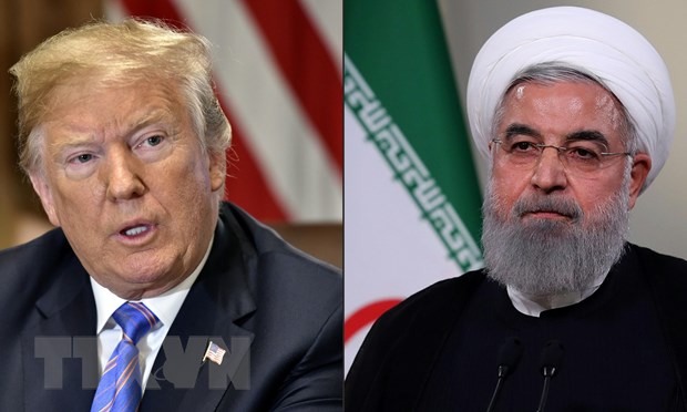 Tổng thống Mỹ Donald Trump (tr&aacute;i) v&agrave; người đồng cấp Iran Hassan Rouhani (phải). (Nguồn: AFP/TTXVN)